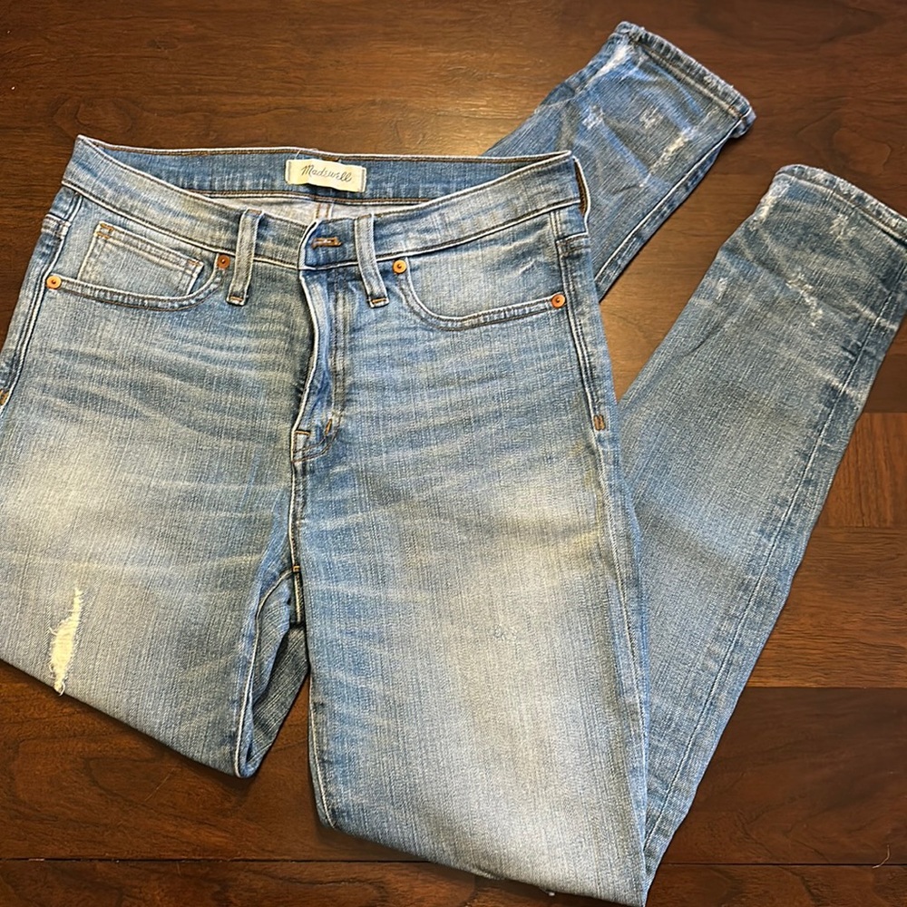 Distressed light wash high rise skinny jeans
